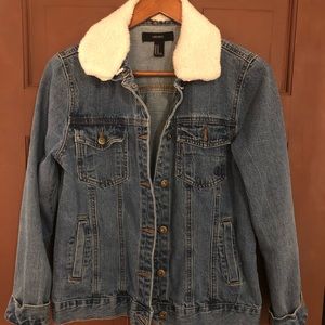 denim jacket with white fur around collar.